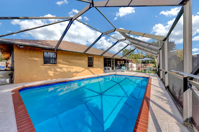 a view of a backyard with a patio and wooden floor