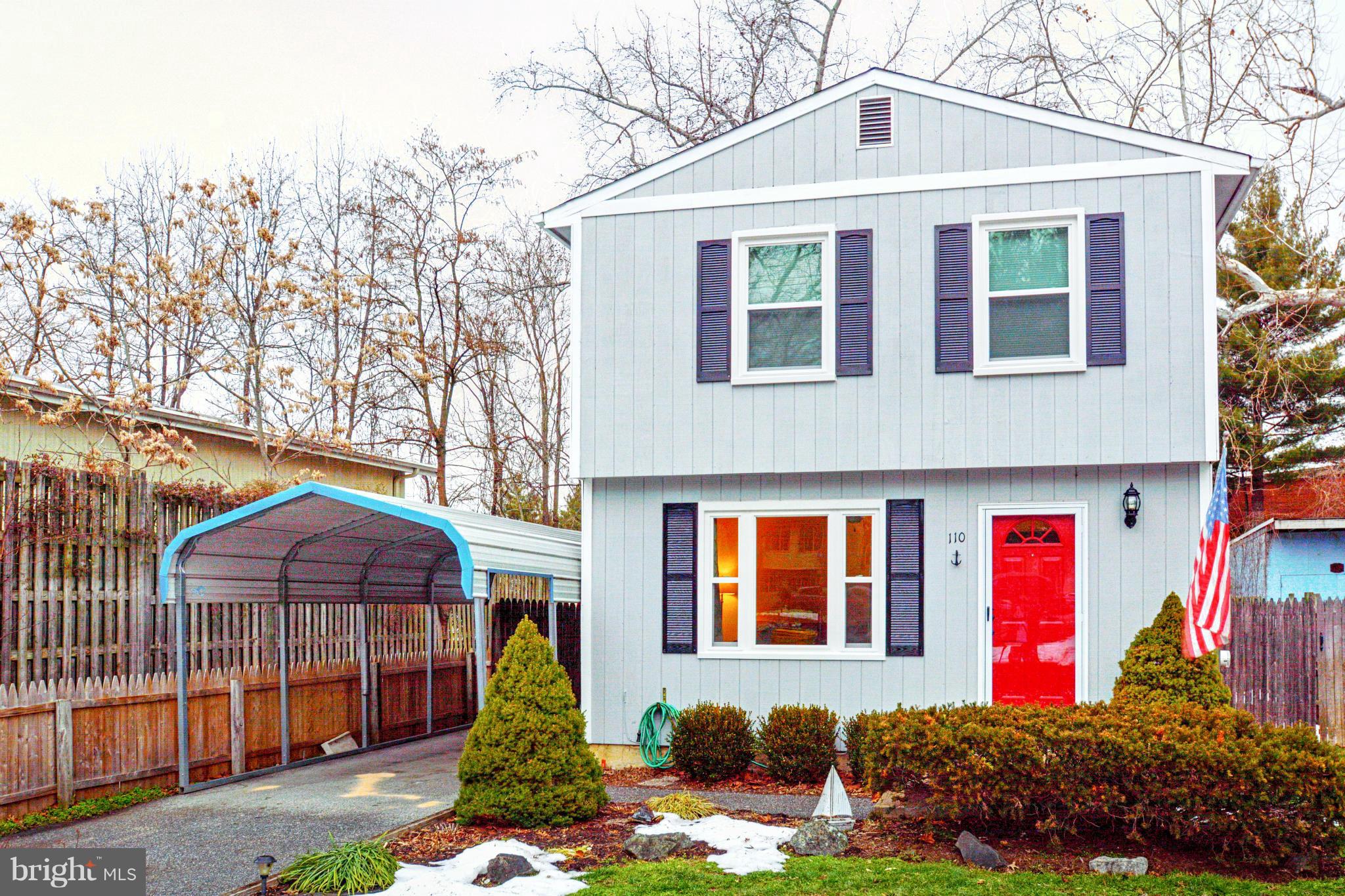 110 Oakwood Road Edgewater, MD 21037 - Photo 1 of 23 a front view of a house with a yard