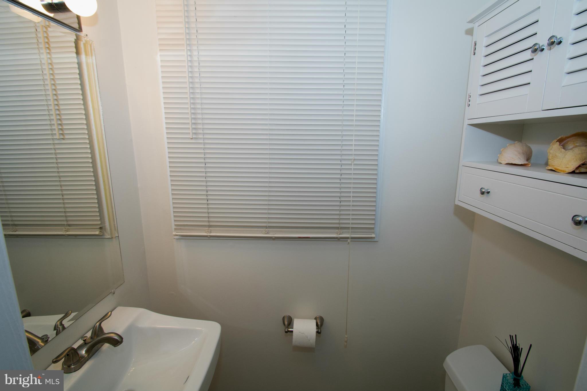 110 Oakwood Road Edgewater, MD 21037 - Photo 12 of 23 a bathroom with a toilet and a sink