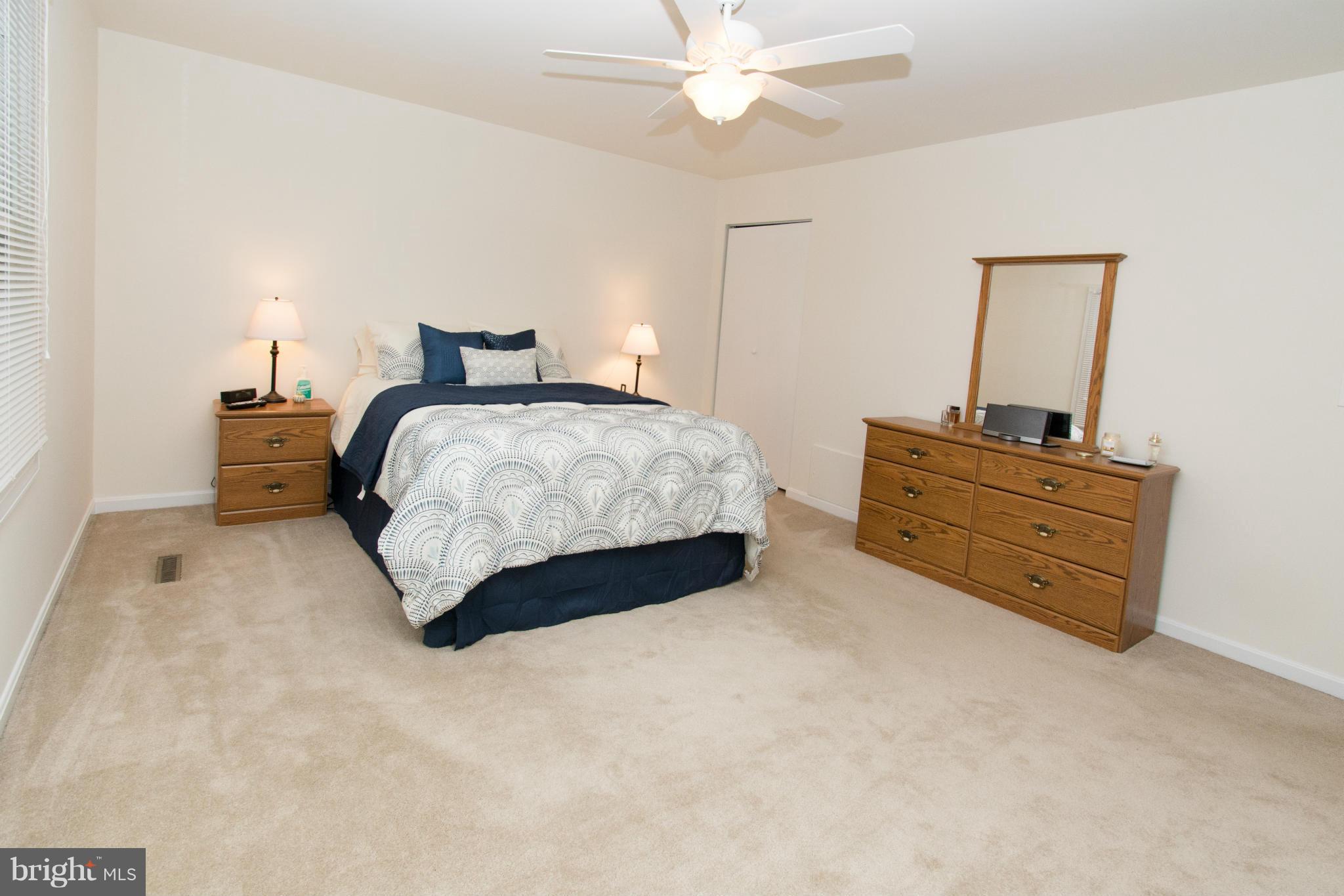 110 Oakwood Road Edgewater, MD 21037 - Photo 14 of 23 a bedroom with a bed and window
