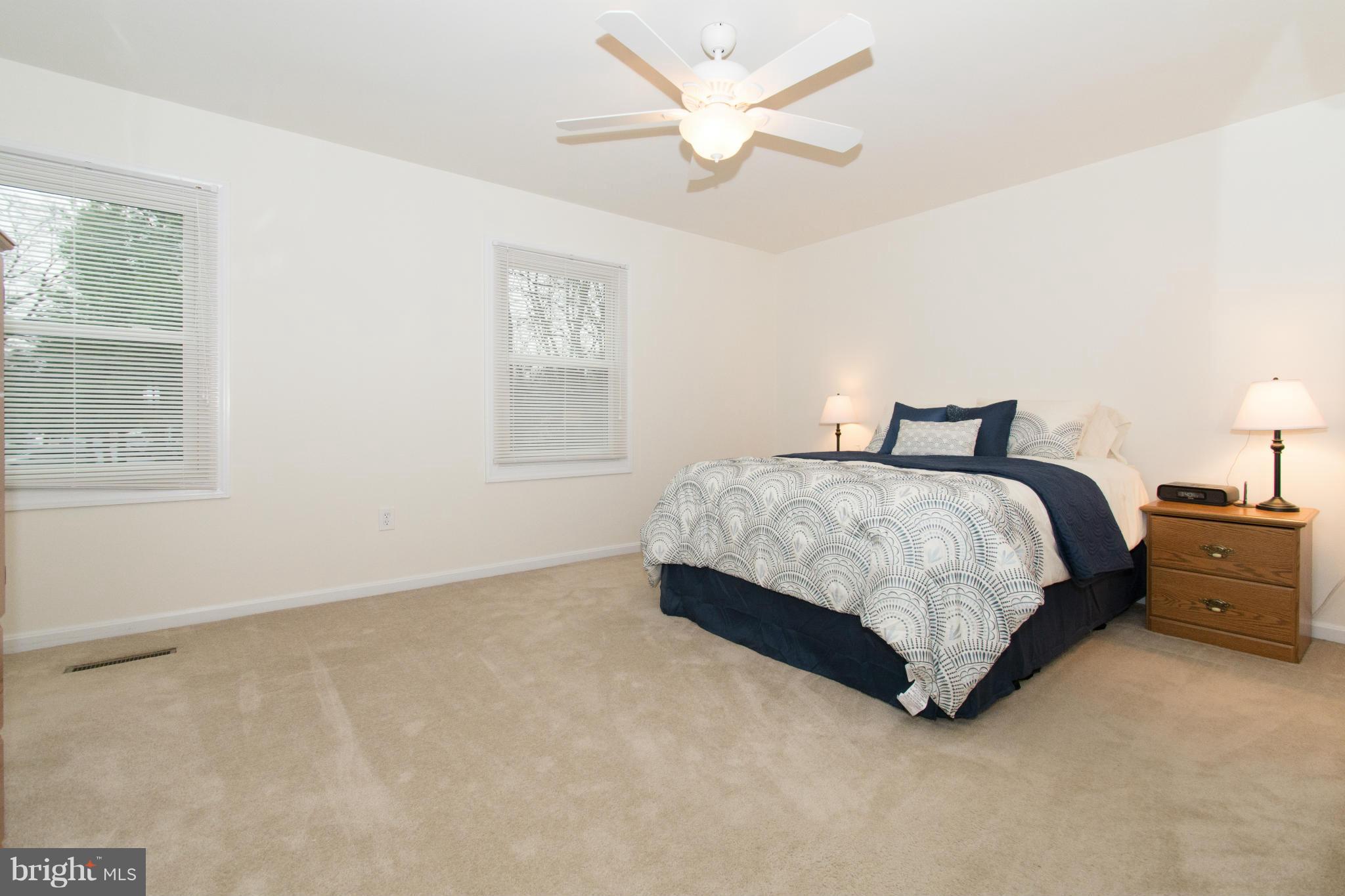 110 Oakwood Road Edgewater, MD 21037 - Photo 15 of 23 a bedroom with a bed and a window