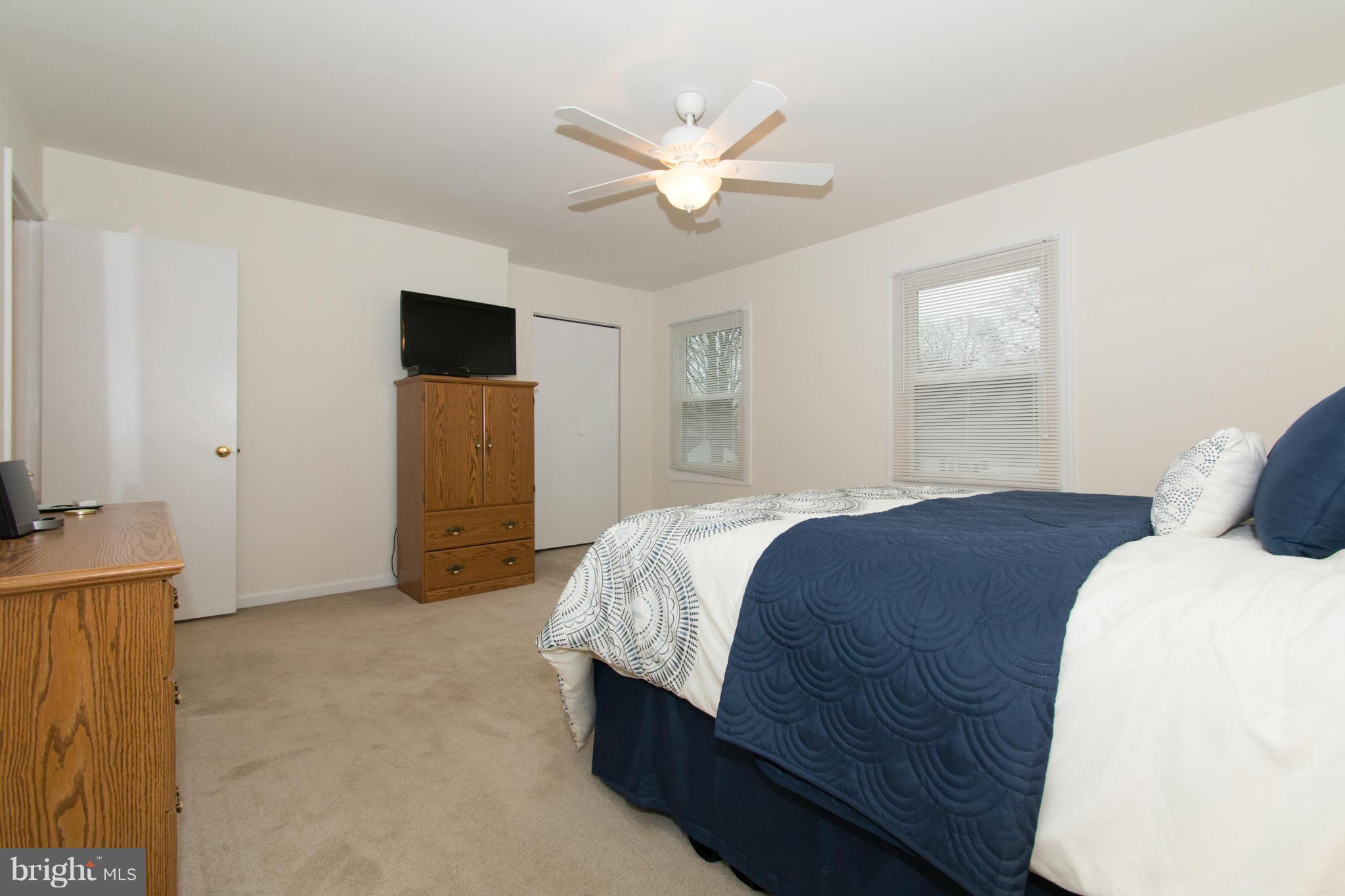 110 Oakwood Road Edgewater, MD 21037 - Photo 16 of 23 a bedroom with a bed and a ceiling fan