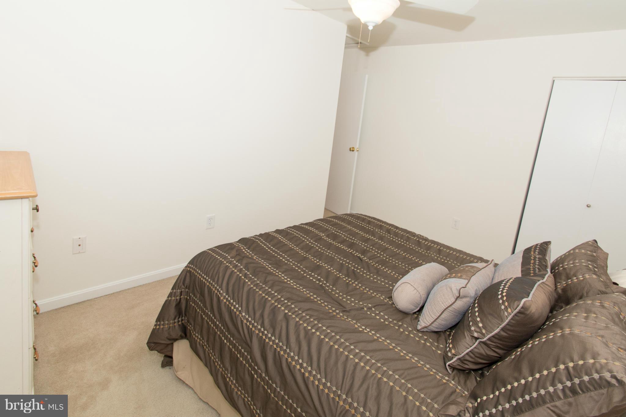 110 Oakwood Road Edgewater, MD 21037 - Photo 19 of 23 a bedroom with a bed and a window