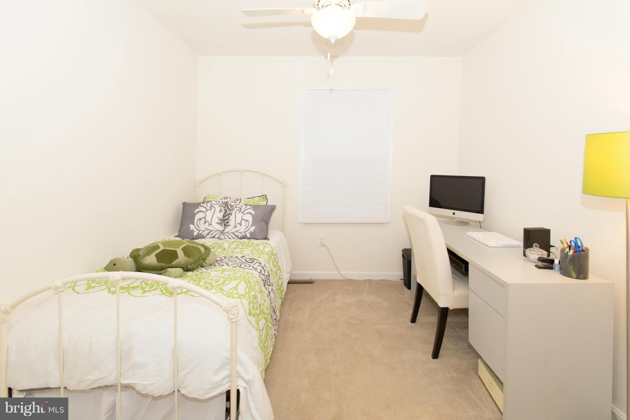 110 Oakwood Road Edgewater, MD 21037 - Photo 20 of 23 a bedroom with a bed and a flat screen tv
