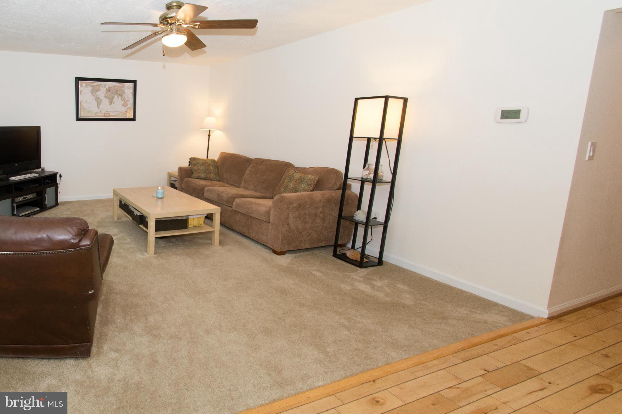 110 Oakwood Road Edgewater, MD 21037 - Photo 3 of 23 a living room with furniture and a flat screen tv
