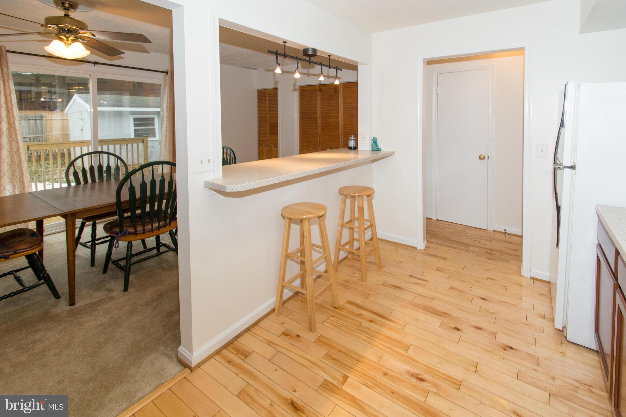 110 Oakwood Road Edgewater, MD 21037 - Photo 4 of 23 a view of a hallway with dining area and chandelier