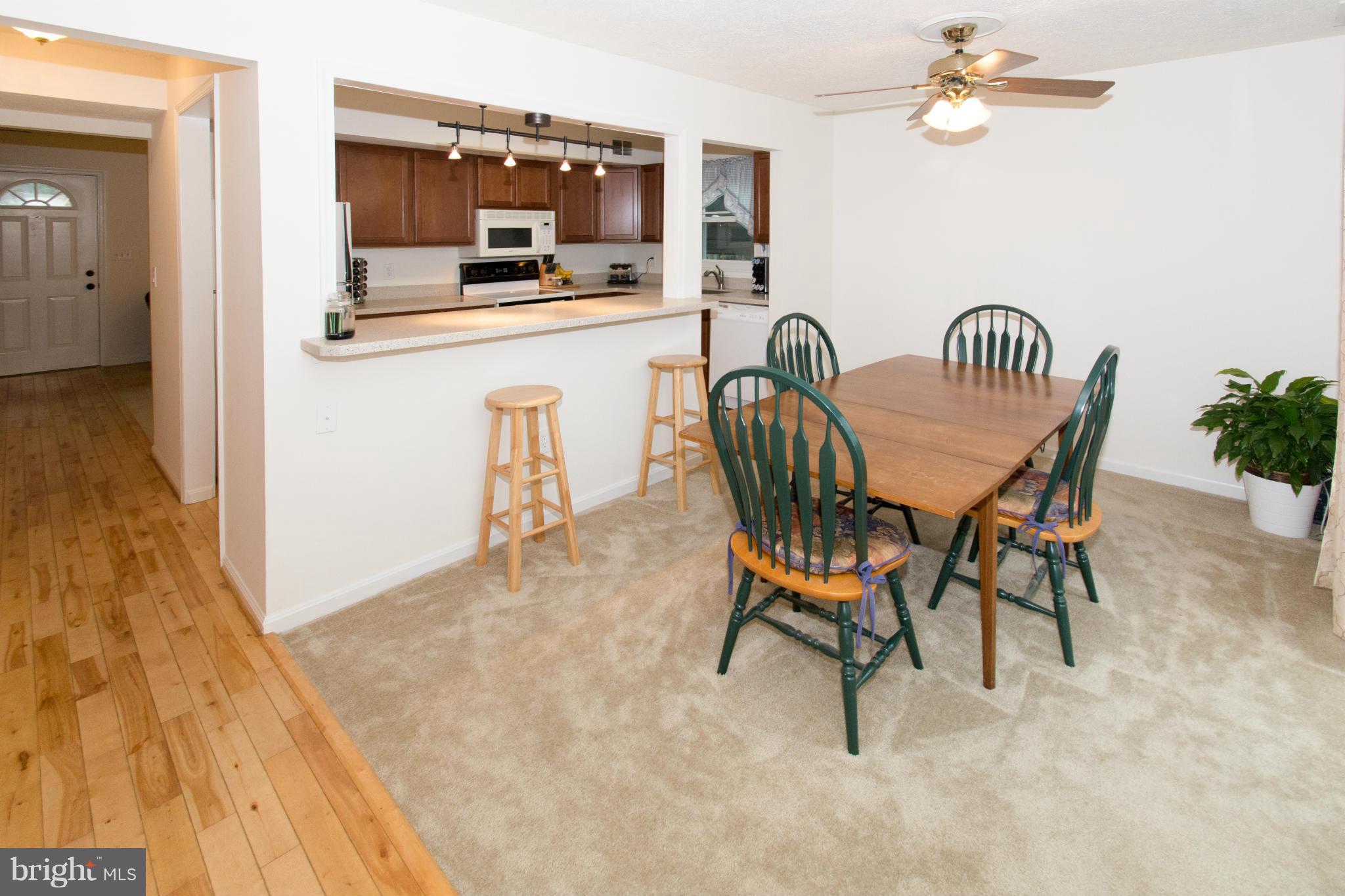 110 Oakwood Road Edgewater, MD 21037 - Photo 9 of 23 a dining room with furniture and window