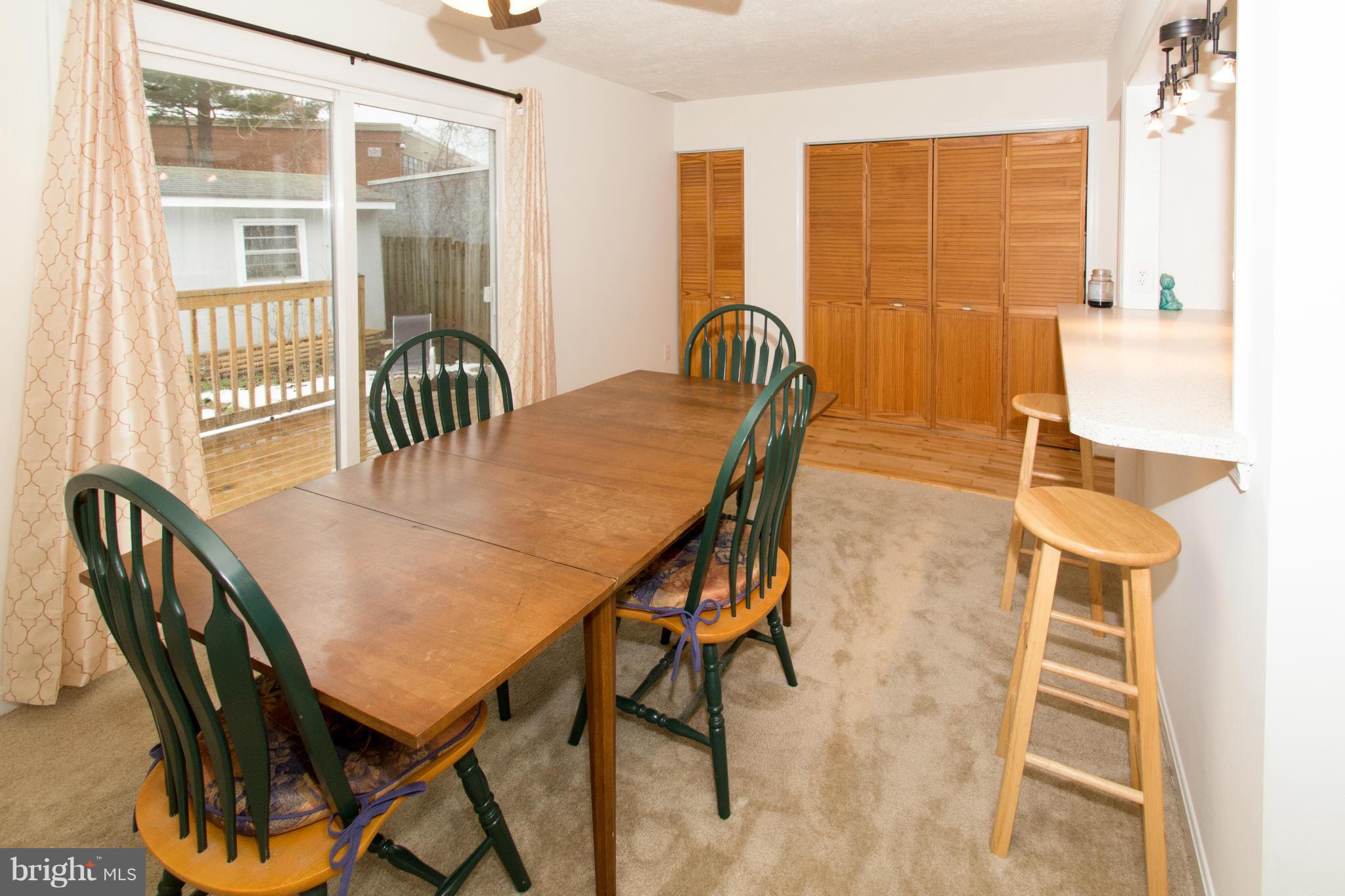 110 Oakwood Road Edgewater, MD 21037 - Photo 10 of 23 a view of a dining room with furniture and wooden floor