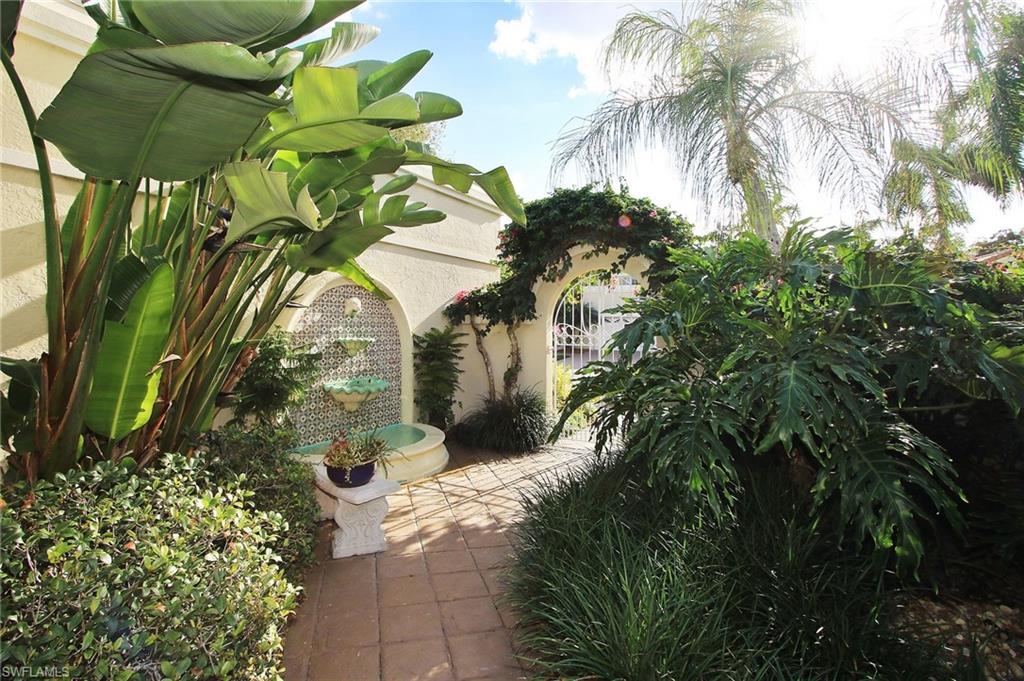 211 Via Napoli Naples, FL 34105 - Photo 2 of 23 a close up of a plant in a garden