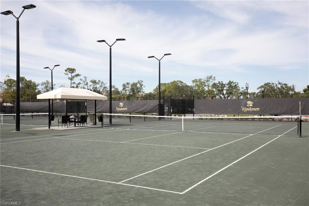 211 Via Napoli Naples, FL 34105 - Photo 22 of 23 a view of a tennis court
