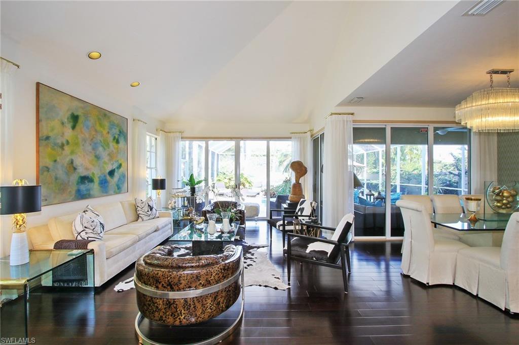 211 Via Napoli Naples, FL 34105 - Photo 3 of 23 a living room with furniture and a large window