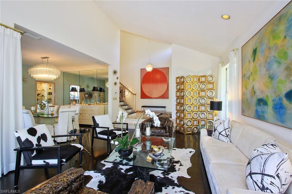 211 Via Napoli Naples, FL 34105 - Photo 4 of 23 a living room with fireplace furniture and wooden floor