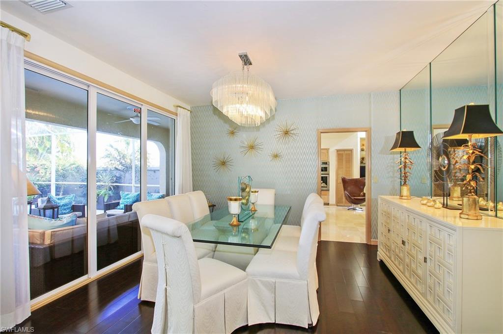 211 Via Napoli Naples, FL 34105 - Photo 6 of 23 a dining room with furniture and a large window