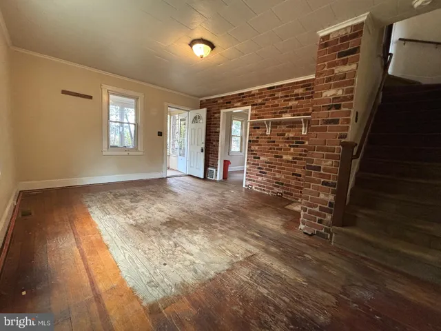 a view of livingroom with window and hardwood floor