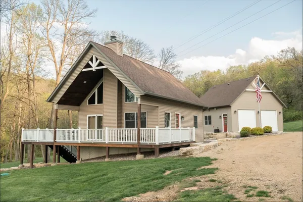 a view of house with yard and entertaining space