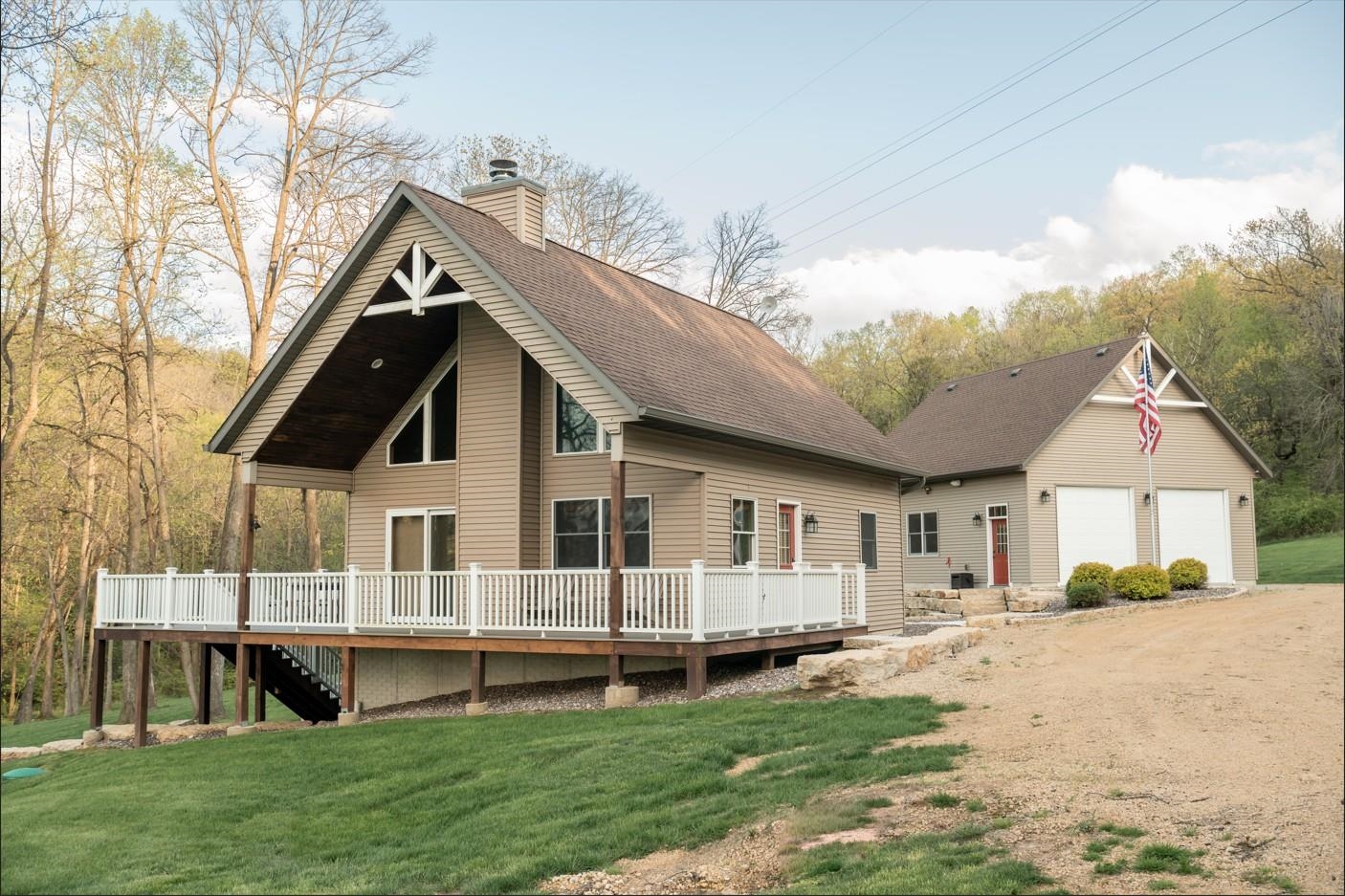 a view of house with yard and entertaining space