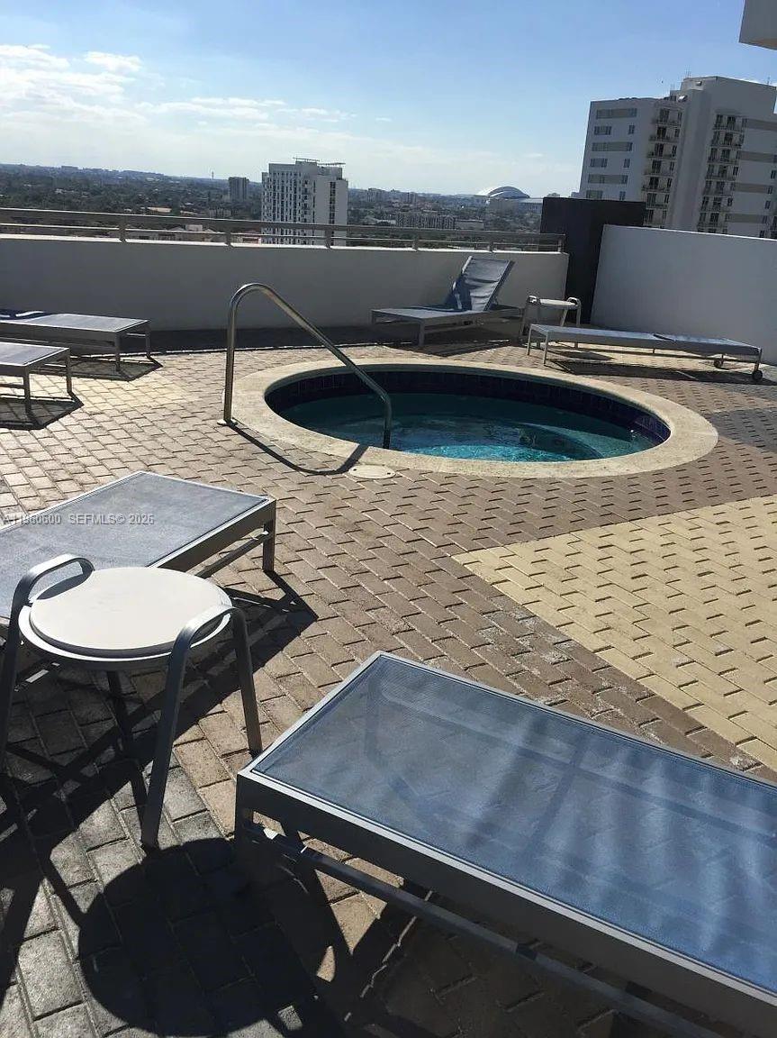 60 Southwest 13th Street, Unit 3405 Miami, FL 33130 - Photo 16 of 17 a view of a outdoor space with lounge chair