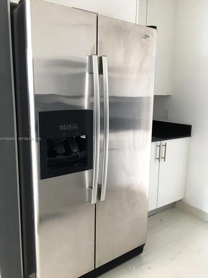 60 Southwest 13th Street, Unit 3405 Miami, FL 33130 - Photo 8 of 17 a close view of a refrigerator in kitchen and a glass door