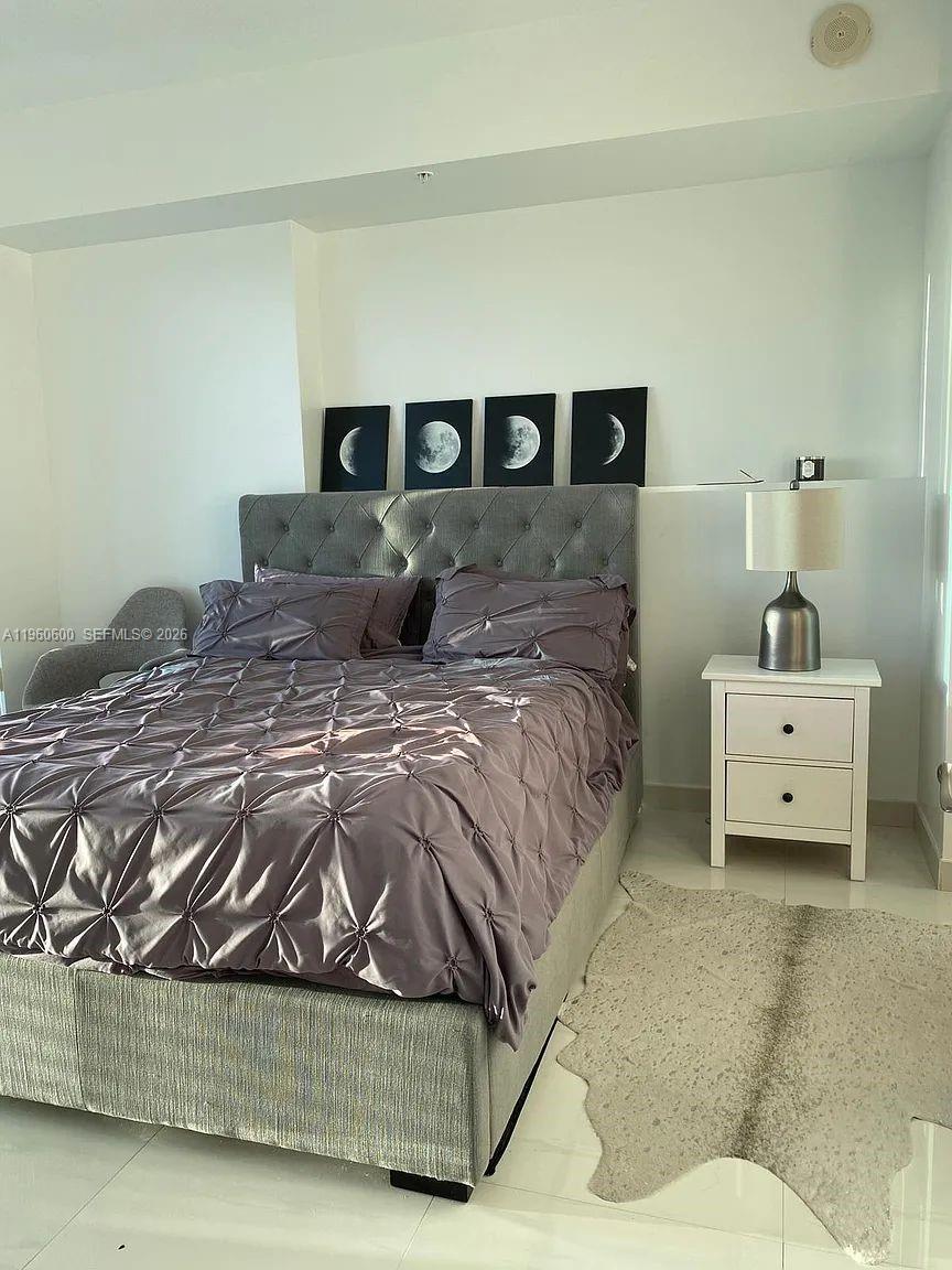 60 Southwest 13th Street, Unit 3405 Miami, FL 33130 - Photo 10 of 17 a bedroom with a bed and window