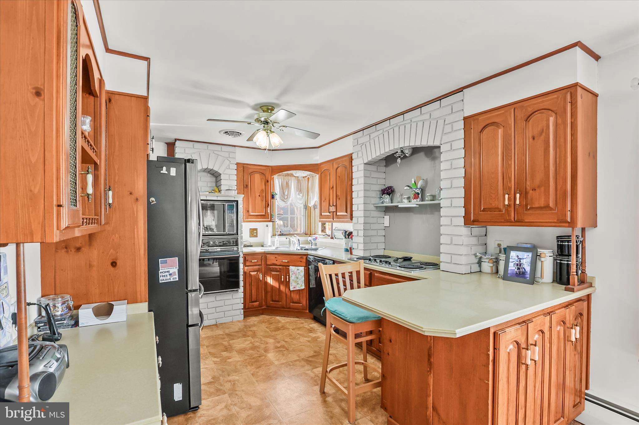4050 Grandview Road Hanover, PA 17331 - Photo 11 of 47 a room with stainless steel appliances a table chairs and chandelier
