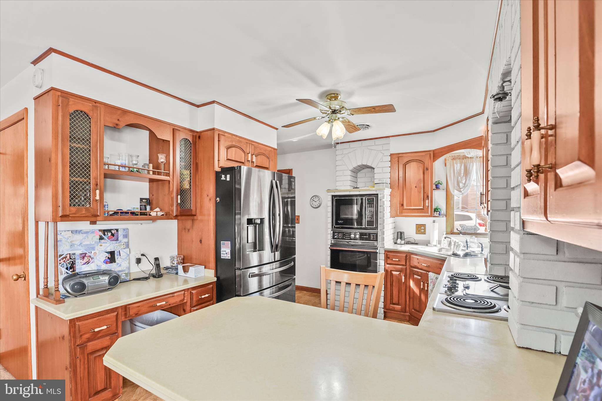 4050 Grandview Road Hanover, PA 17331 - Photo 12 of 47 a large kitchen with stainless steel appliances a stove a refrigerator a oven with white cabinets and wooden floor