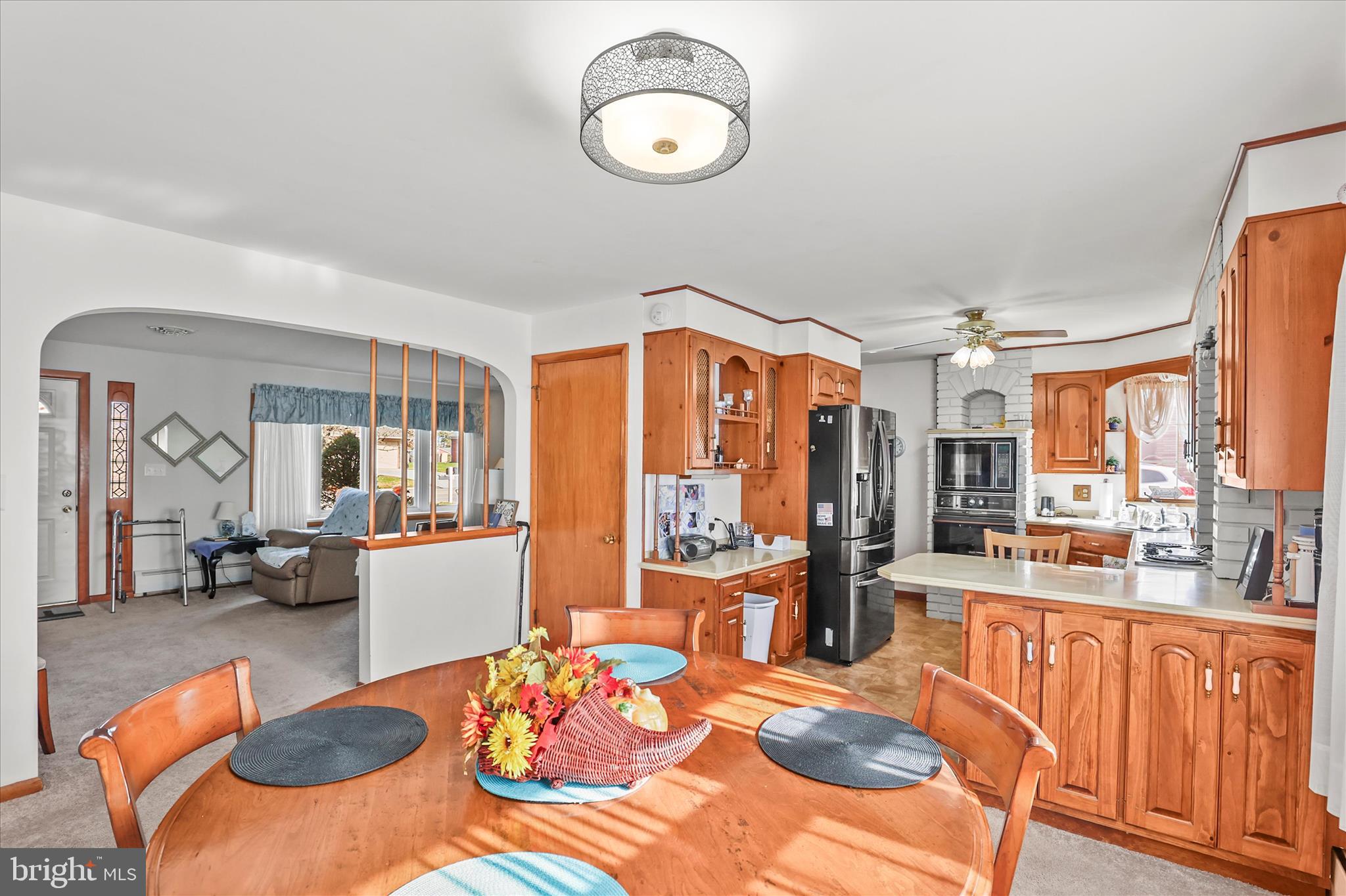 4050 Grandview Road Hanover, PA 17331 - Photo 10 of 47 a view of a dining room with furniture large windows and wooden floor