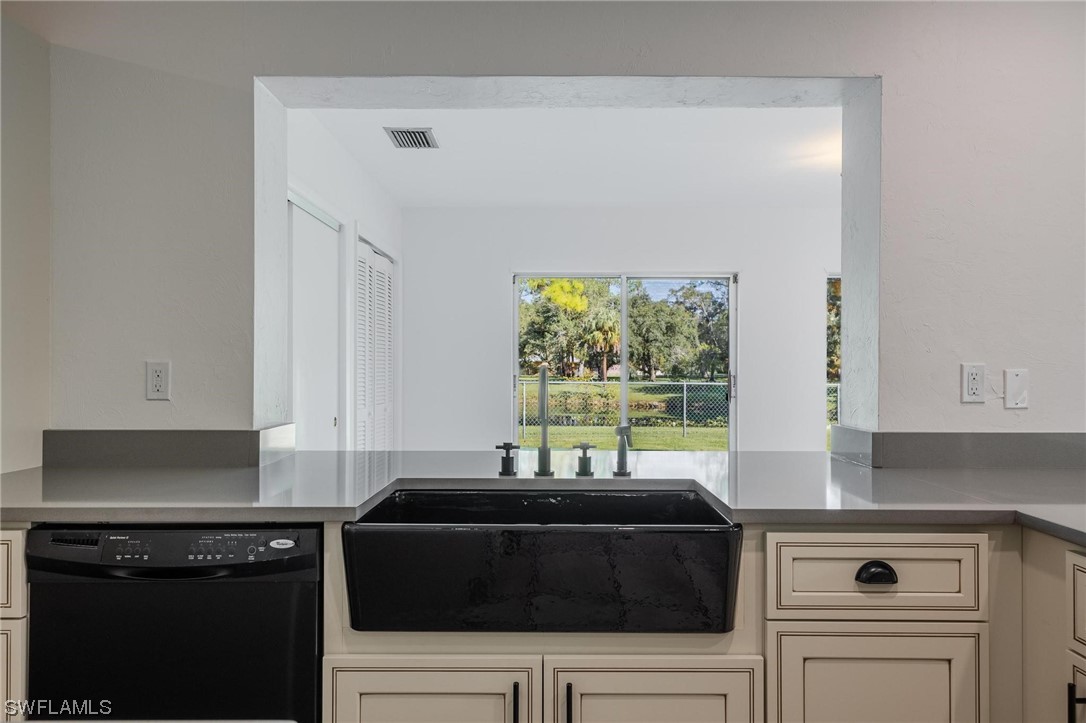 1850 Fort Denaud Road LaBelle, FL 33935 - Photo 13 of 37 a kitchen with a stove and a white cabinet