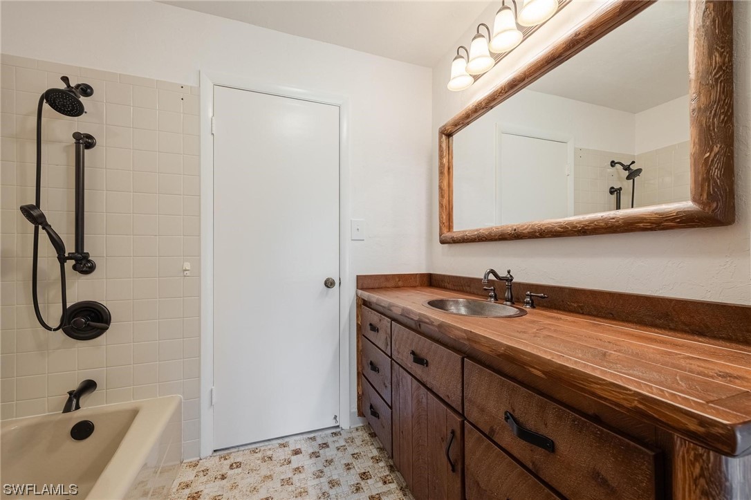 1850 Fort Denaud Road LaBelle, FL 33935 - Photo 20 of 37 a bathroom with a sink a toilet a mirror and shower