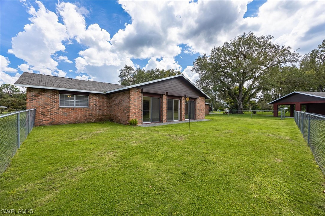 1850 Fort Denaud Road LaBelle, FL 33935 - Photo 28 of 37 a view of an house with backyard space and garden