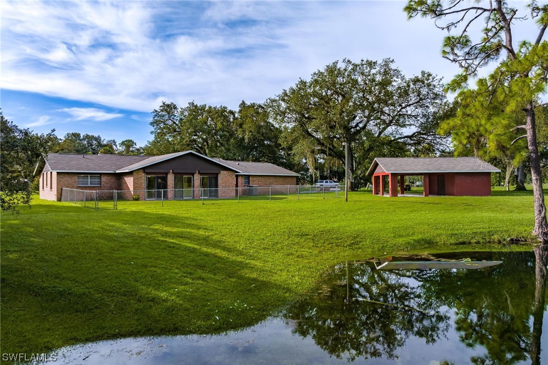 1850 Fort Denaud Road LaBelle, FL 33935 - Photo 29 of 37 a front view of house with yard and green space