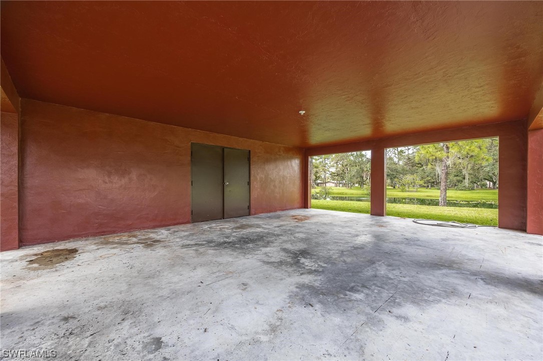 1850 Fort Denaud Road LaBelle, FL 33935 - Photo 31 of 37 a view of an empty room with a large window and outside view