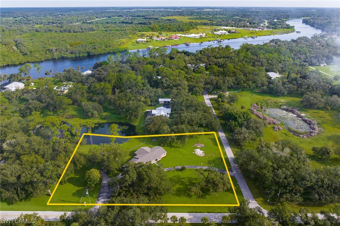 1850 Fort Denaud Road LaBelle, FL 33935 - Photo 37 of 37 an aerial view of swimming pool with a yard