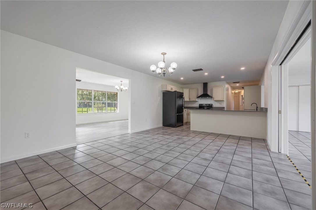 1850 Fort Denaud Road LaBelle, FL 33935 - Photo 10 of 37 a view of a kitchen with a sink and a refrigerator