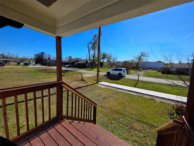 a view of a balcony with chairs