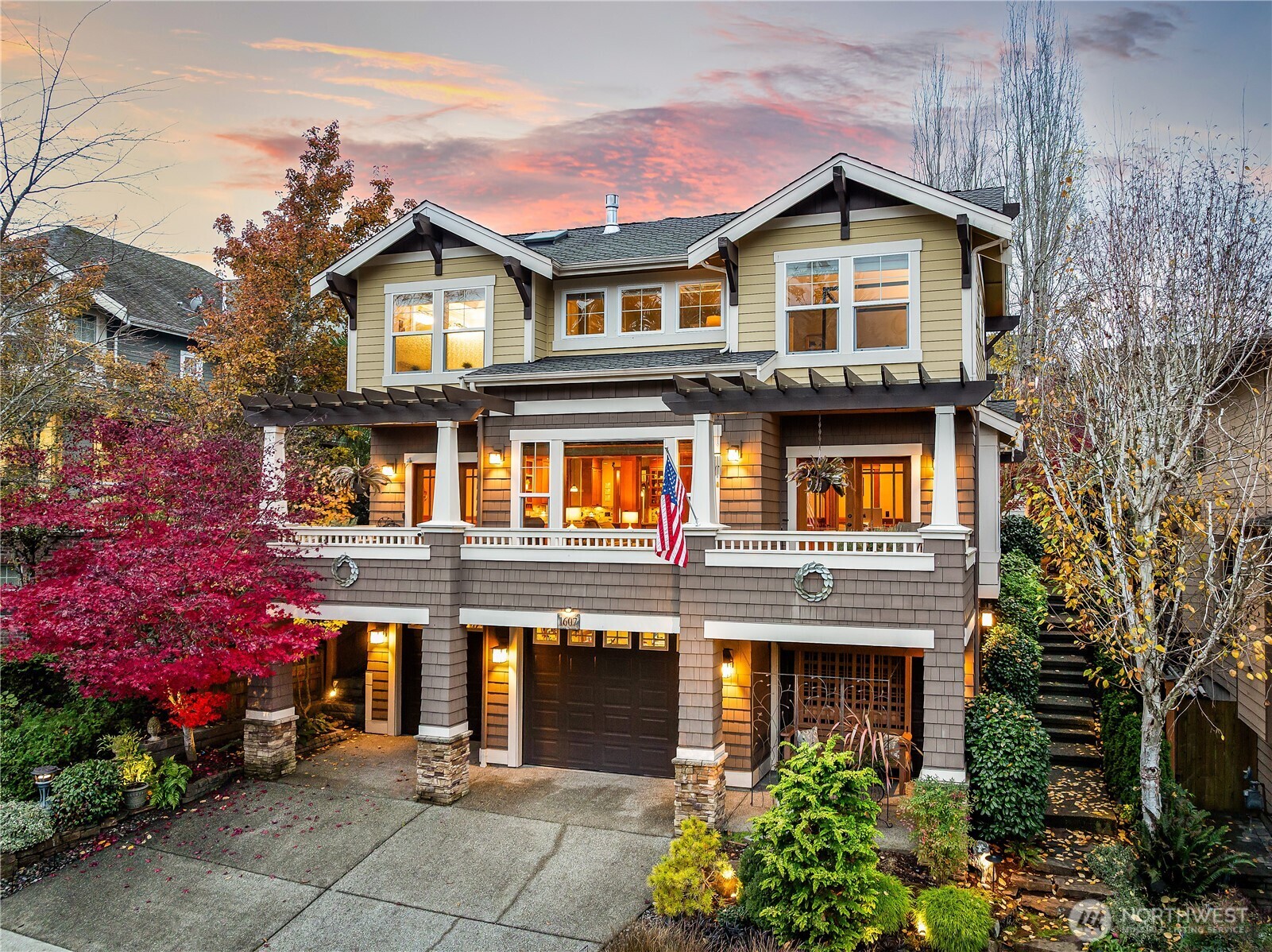 a front view of a house with plants