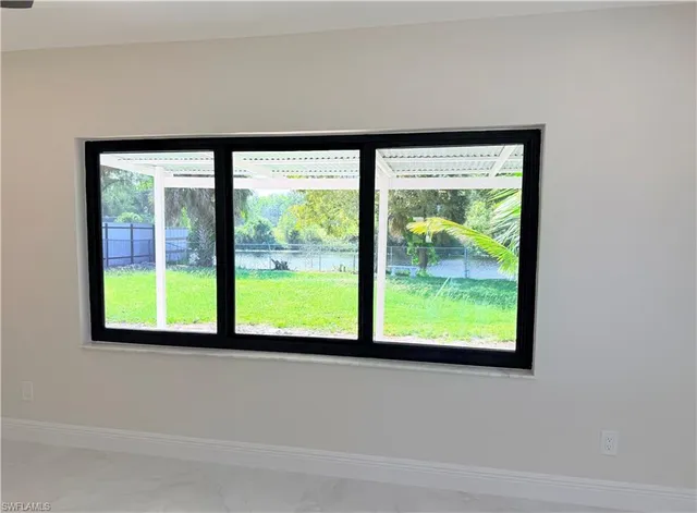 a view of a room with a large window