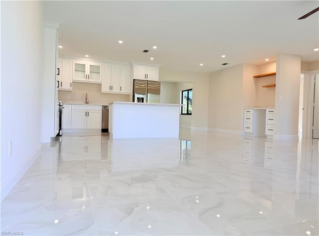 4212 32nd Avenue Southwest Naples, FL 34116 - Photo 25 of 27 a view of kitchen with refrigerator and window