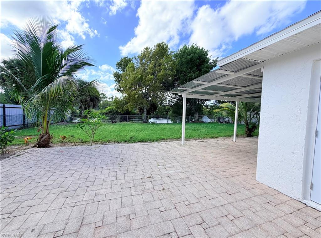 4212 32nd Avenue Southwest Naples, FL 34116 - Photo 19 of 27 a view of a house with backyard and a garden