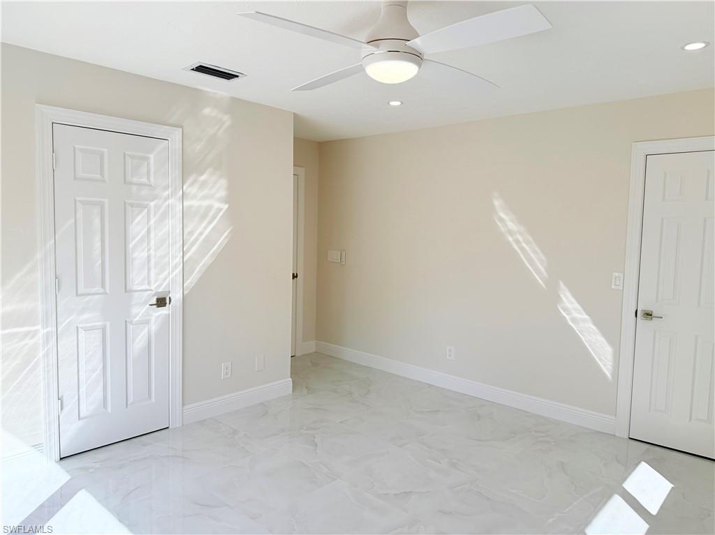 4212 32nd Avenue Southwest Naples, FL 34116 - Photo 3 of 27 wooden floor in an empty room