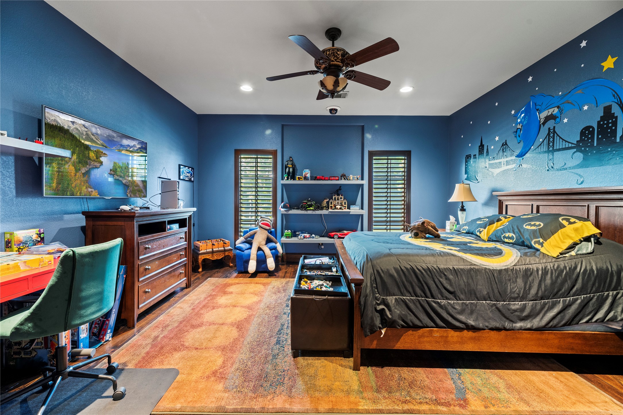 7715 Firethorne Creek Court Spring, TX 77389 - Photo 11 of 50 a bed room with furniture and a flat screen tv