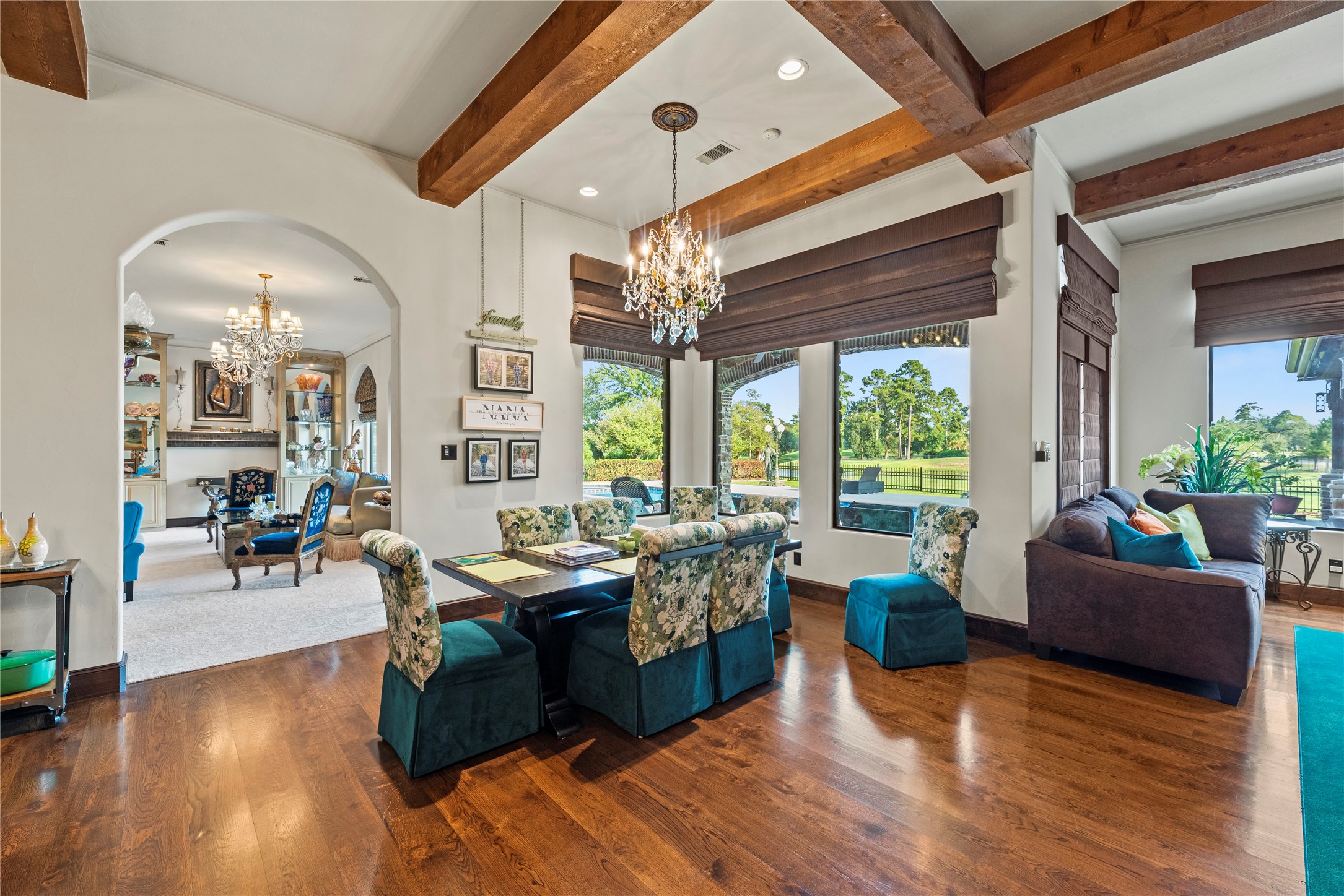 7715 Firethorne Creek Court Spring, TX 77389 - Photo 14 of 50 Luxurious breakfast area with automated drapes for effortless ambiance control.
