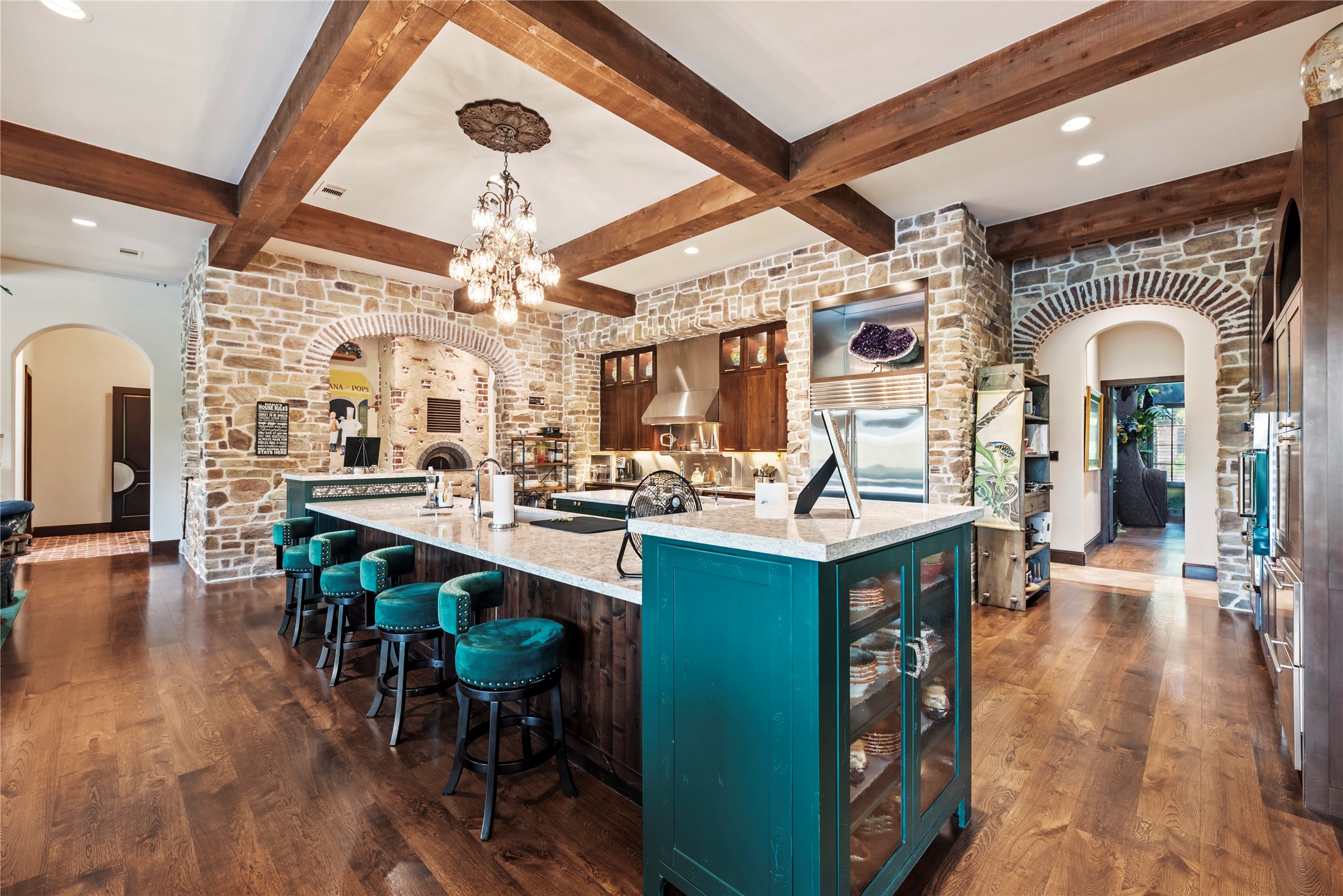 7715 Firethorne Creek Court Spring, TX 77389 - Photo 19 of 50 a large kitchen with a table and chairs