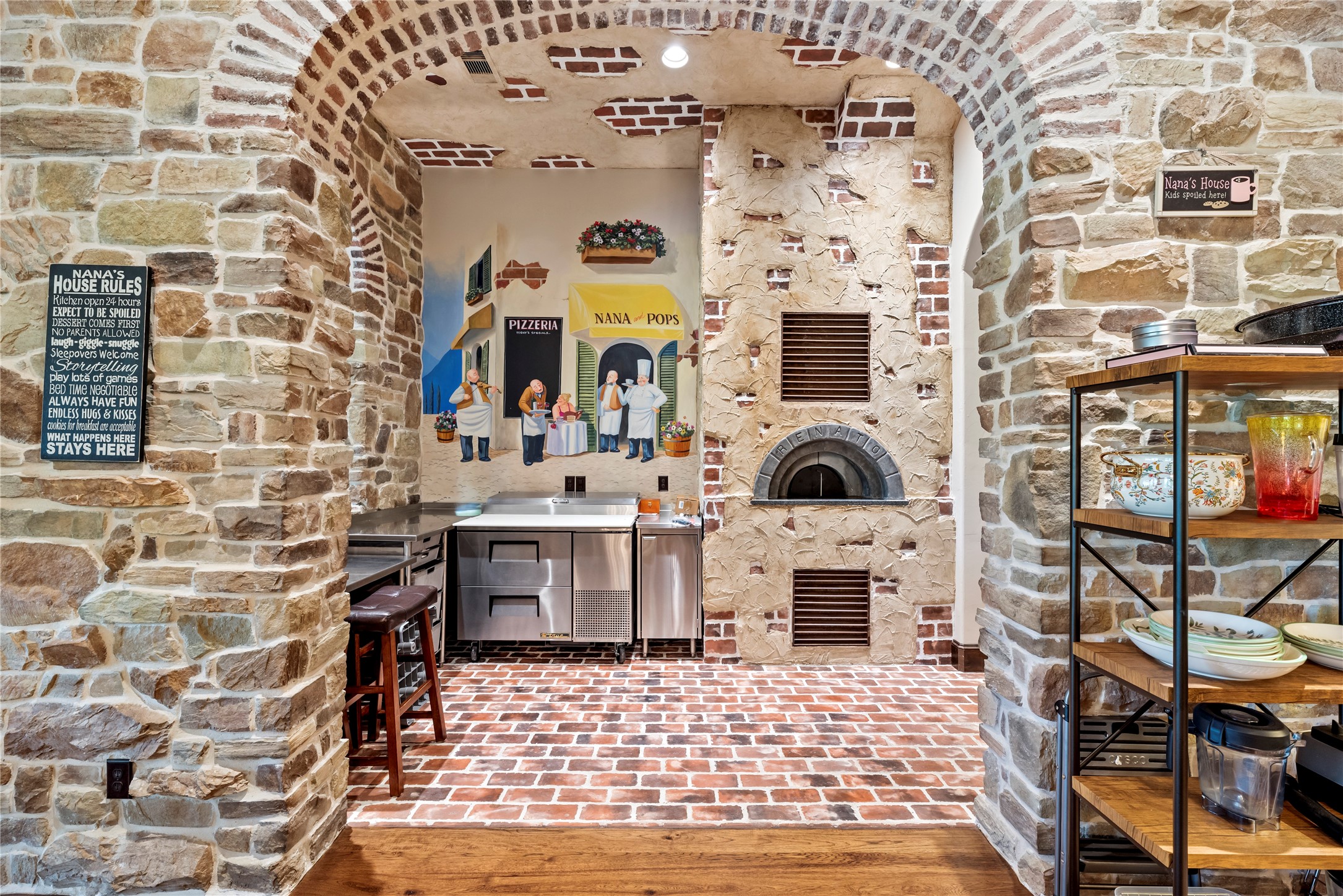7715 Firethorne Creek Court Spring, TX 77389 - Photo 20 of 50 Charming kitchen with a built-in pizza oven, perfect for entertaining and creating authentic culinary experiences.
