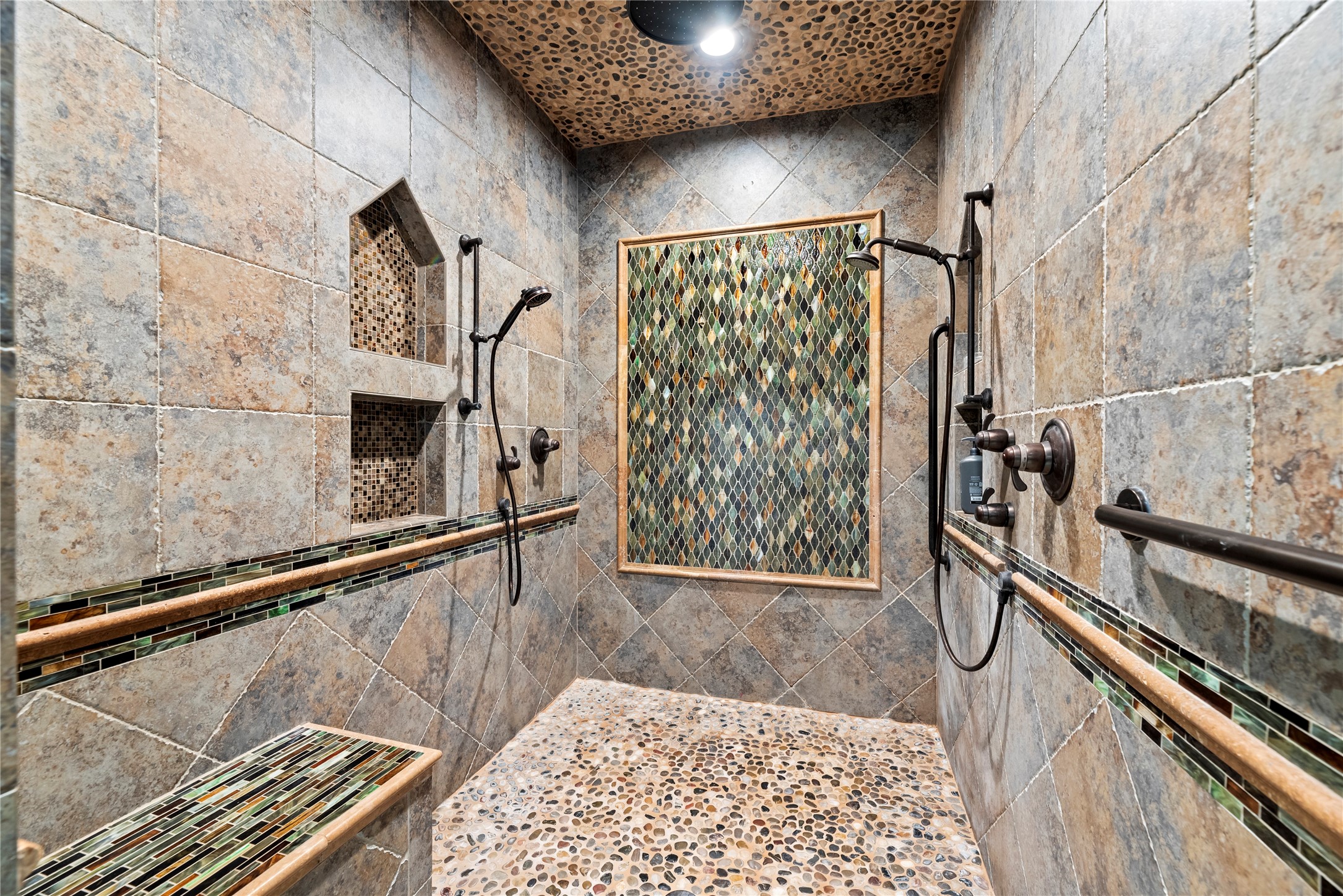 7715 Firethorne Creek Court Spring, TX 77389 - Photo 26 of 50 Spacious walk-in shower with elegant tile design.