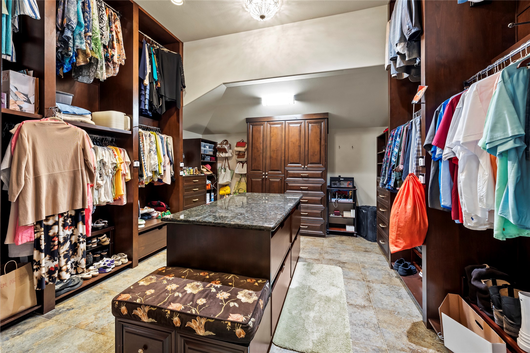 7715 Firethorne Creek Court Spring, TX 77389 - Photo 27 of 50 a view of walk in closet with clothes and shoes