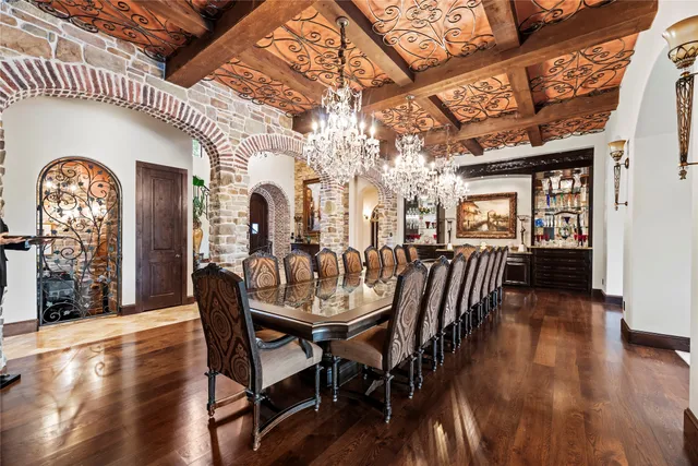 a kitchen with a refrigerator and a stove top oven