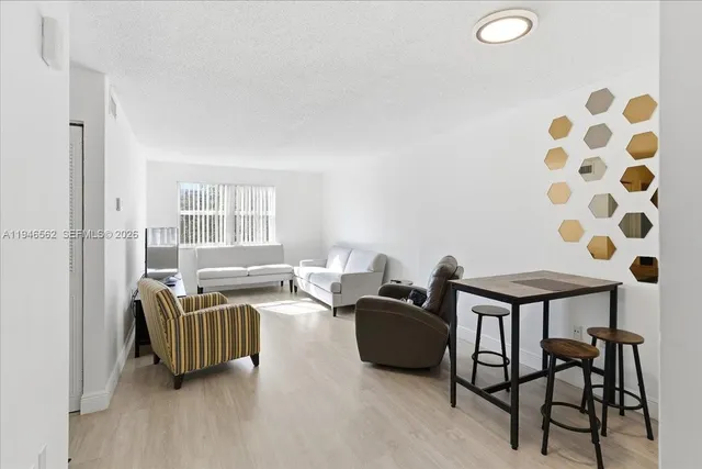 a living room with furniture and a window