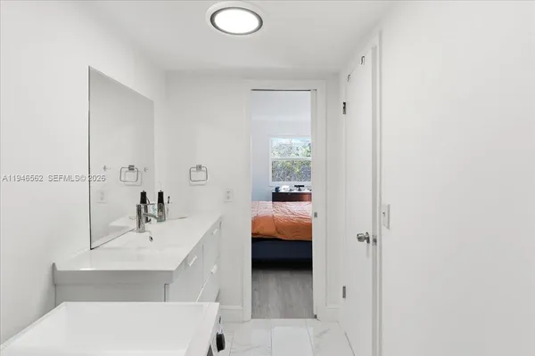 a en suite bathroom with a sink and a tub