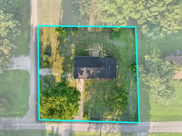 a small pool with trees in the background