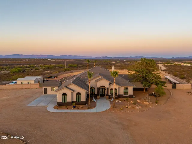an aerial view of a house with a ocean view